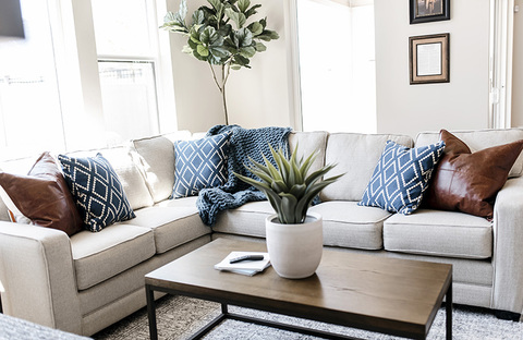 Down to Earth Projects | Jalais Lane - White sectional throw pillows metal frame coffee table 