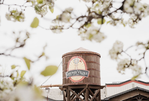 Gardner Village During Spring - spring  blooms over the water tower at gardner village 