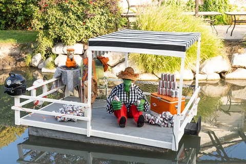 Gardner Village Witch Displays - witch on a boat surrounded by diet coke cans 