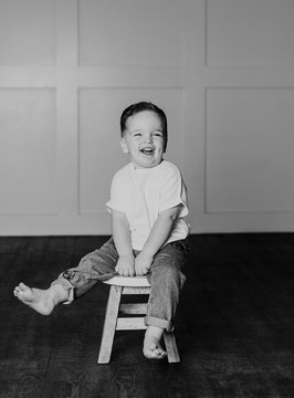 Camera Shy Photography - young boy on a stool in photography studio 