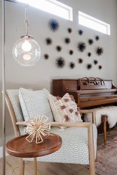 Down to Earth Projects | Draper Residence - living room with piano and wall art 