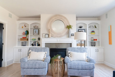 Down to Earth Projects | Draper Residence - great room with light blue chairs and white cabinets 