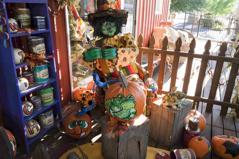 Gardner Village Witch Displays - witch painting pumpkins 