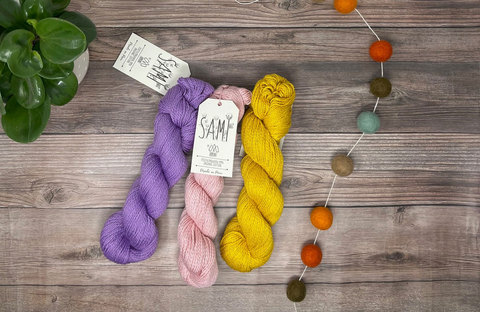 Willow Hill Yarn Company - red pink and yellow skeins of yarn 