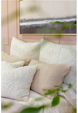 Murphy Pillow - textured cream pillows on bed 