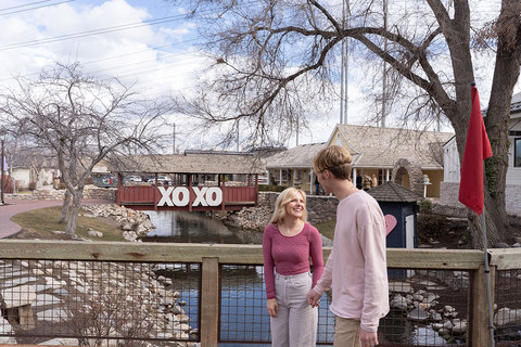Lots to Love at Gardner Village - couple walking along path in front of the bridge 