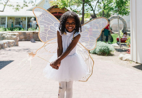 Woodland Fairy Festival - young girl dressed as a fairy in white 