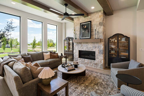 Down to Earth Projects<br>Symphony Homes Parade with Ninth + North Design - family room with curved sofa 