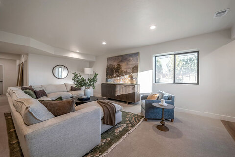 Down to Earth Projects<br>Symphony Homes Parade Ninth + North Design - basement family room with sectional 