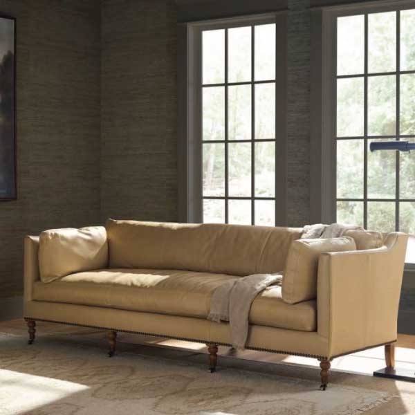 down to earth leather sofa in moody room